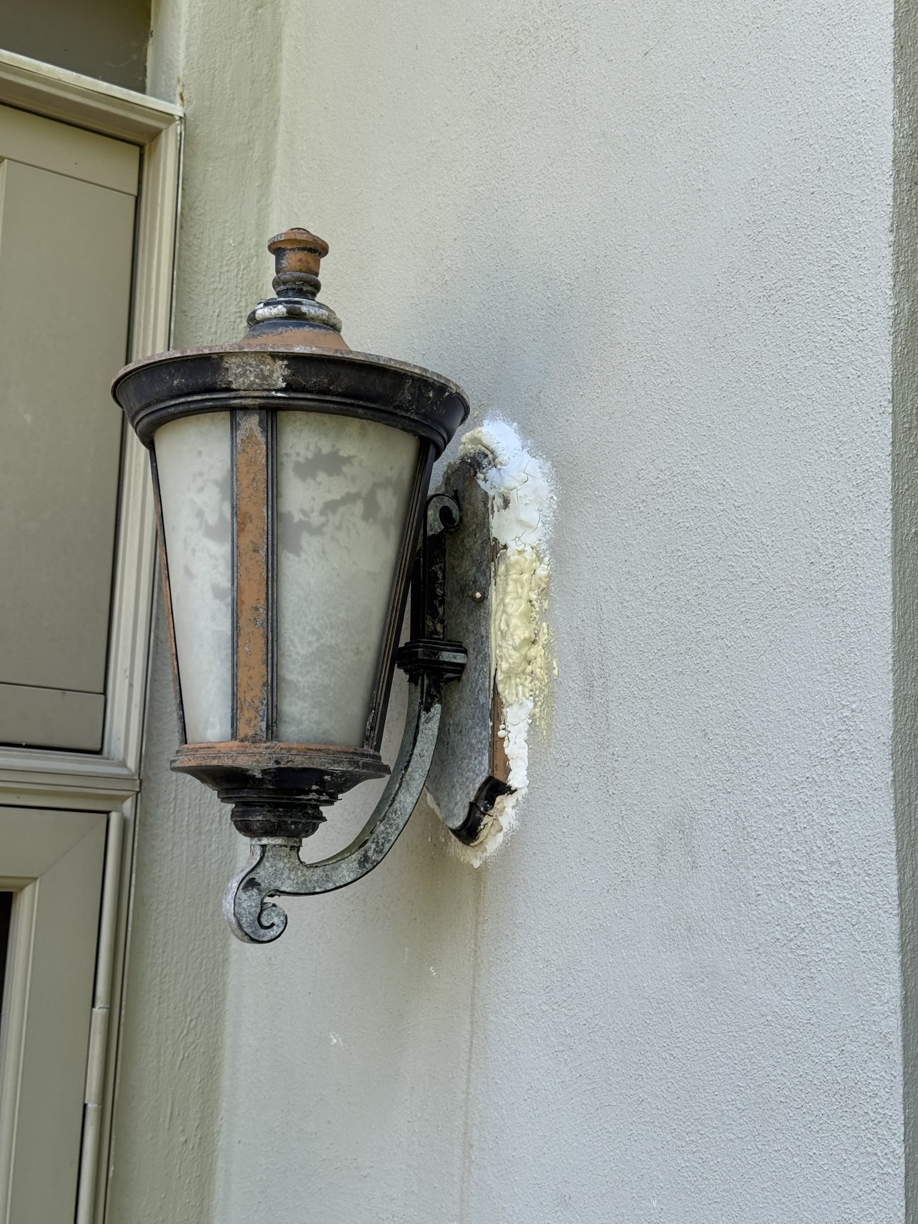 Old exterior light fixture before replacement